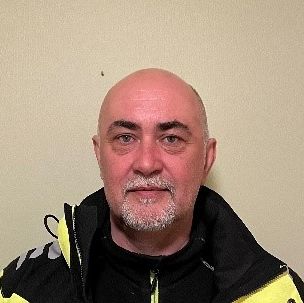 Bilde av mann med skjegg og arbeidsklær